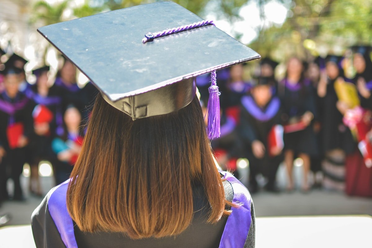 Graduation ceremony with doctoral robes and formal academic setting