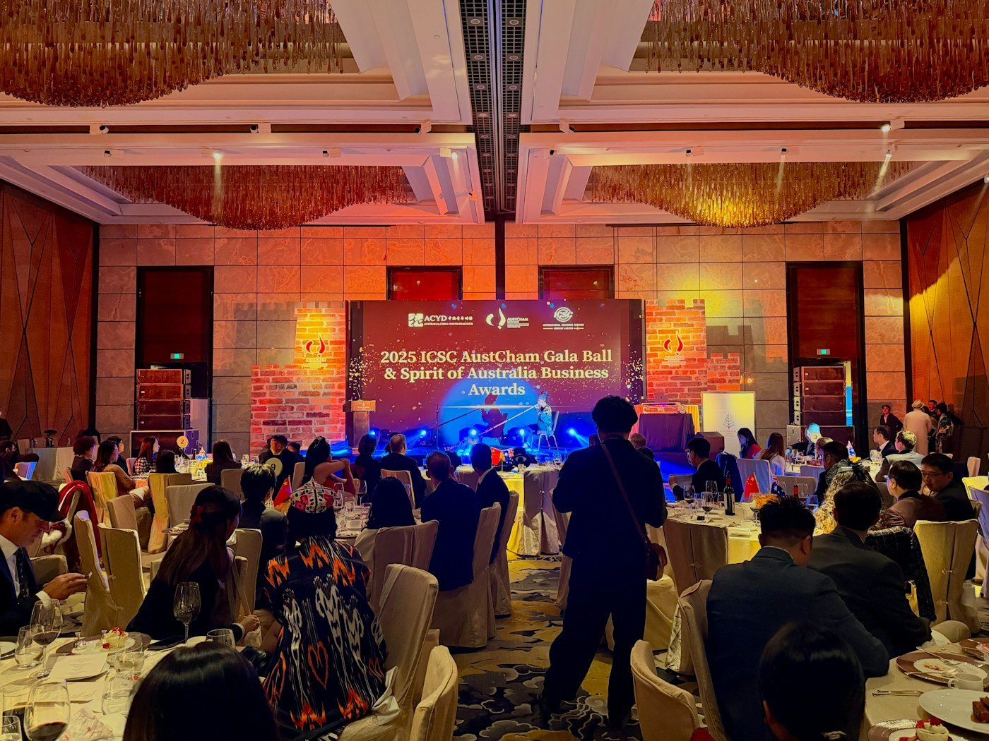 Premium award ceremony with stage, lights, and seated guests