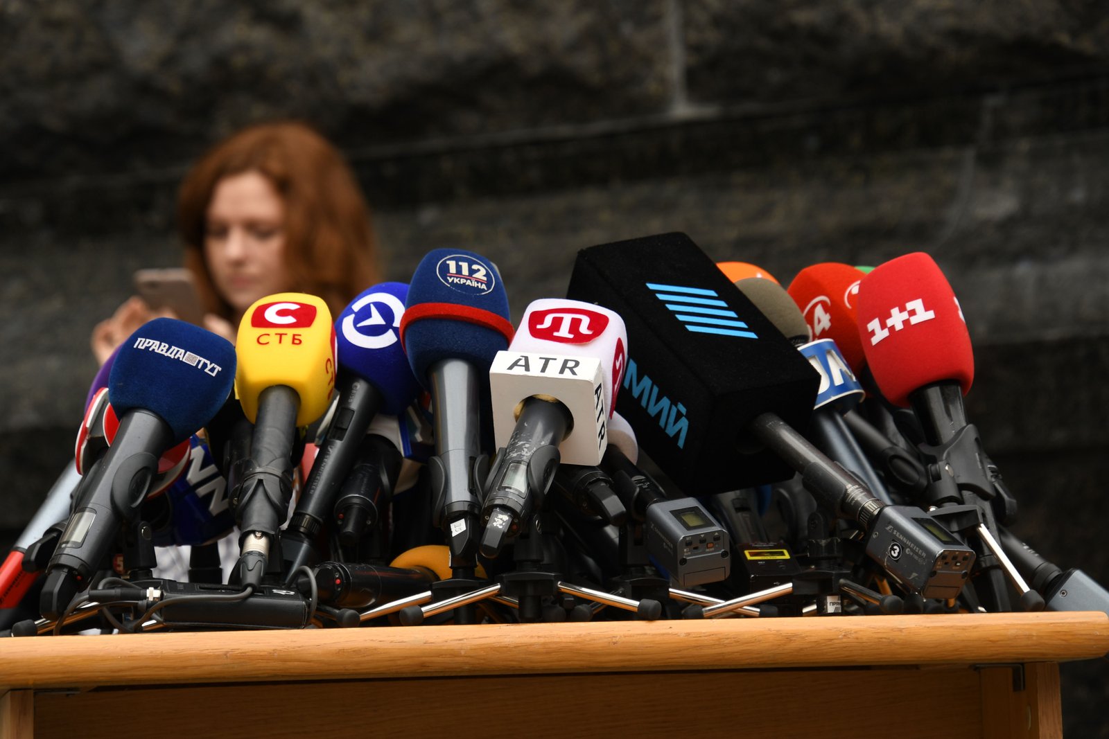 Press microphones arranged for a media briefing